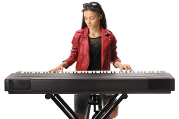 Young female playing a keyboard