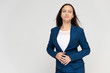 © Вячеслав Чичаев - Portrait of a young pretty brunette woman manager 30 years in a business blue suit with beautiful dark hair. on a white background, talking, showing hands, demonstrating emotions.