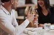 © standret - In official wear. Beautiful couple have romantic dinner in luxury restaurant at evening time