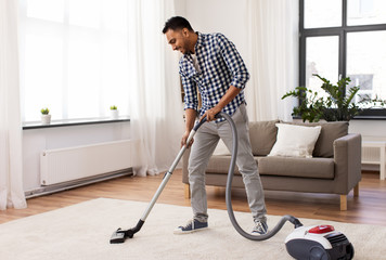 Sticker - household and cleaning concept - indian man with vacuum cleaner at home