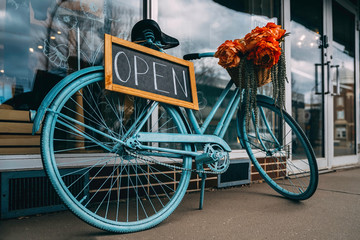 Bicycle with creative open signboard. Open store