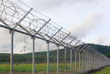 Fototapeta  - Background War Net Barrier Barbed Wire Conflict in Phuket Thailand