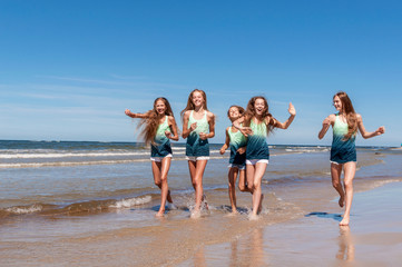 Girls walking on the beach