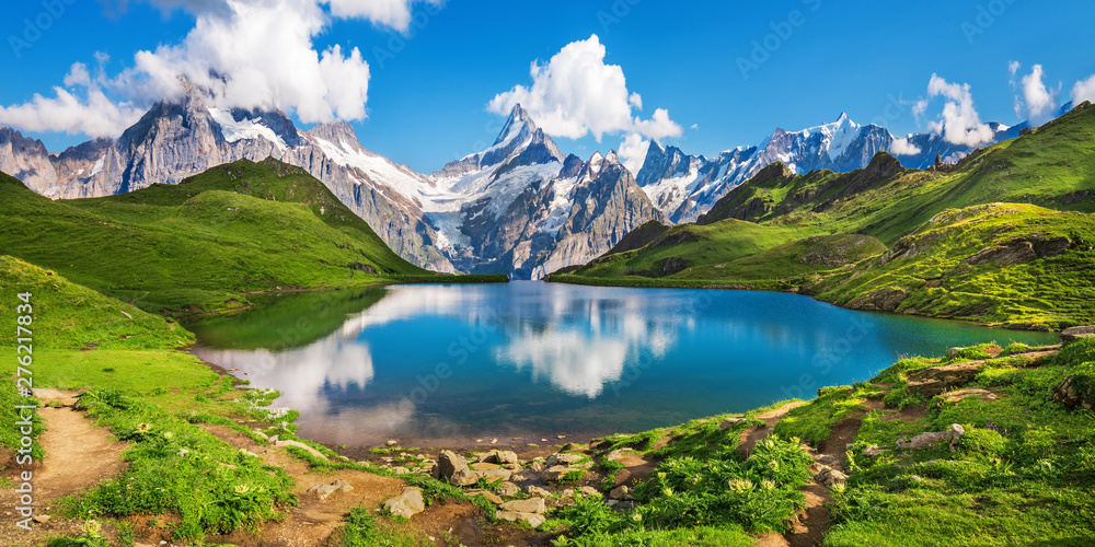 Scenic view on Bernese range above Bachalpsee lake. Popular tourist attraction. Location place Swiss alps, Grindelwald valley, Europe.  - obrazy, fototapety, plakaty 