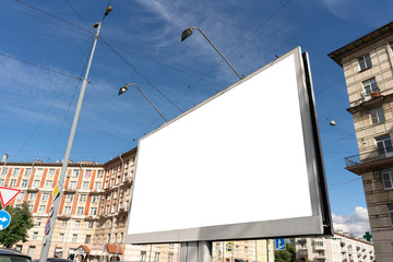 billboard 3 by 6 meters big standing in the city. White advertising space for design placement. on a nice summer day with blue sky