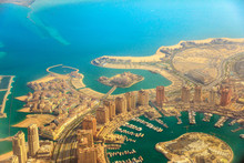 Aerial View Of The Pearl-Qatar, The Luxurious Modern Artificial Island In The Persian Gulf, Venice At Qanat Quartier, Marsa Malaz Kempinski Hotel And Towers Of Porto Arabia, Doha, Qatar.