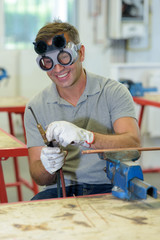 Wall Mural - middle aged man wearing goggles for welding