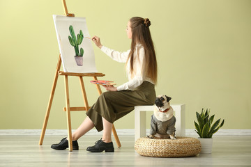 Canvas Print - Teenage artist with cute pug dog at home