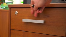 Lock The Drawer Of The Bedside Table With A Key.