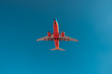 Airliner in blue sky. Travel, air transportation concept