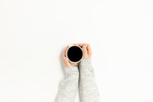 Woman's Hands In A Sweater Holding A Mug Of Coffee On White Background