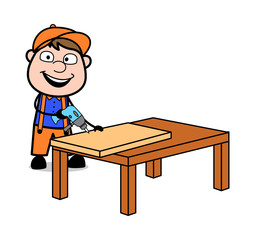 Wall Mural - Making a Hole in a Board with Drilling Machine - Retro Cartoon Carpenter Worker Vector Illustration
