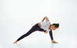 © master1305 - Sporty young woman doing yoga practice isolated on white studio background. Fit flexible female model practicing. Concept of healthy lifestyle and natural balance between body and mental development.