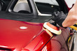 Close up of person cleaning car exterior