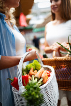 Woman Holding A Basket With Healthy Organic Vegetables