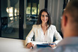 © bnenin - Portrait of a female real estate agent on a meeting with a client.