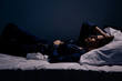 Sad alone woman lying the bed. Insomnia concept