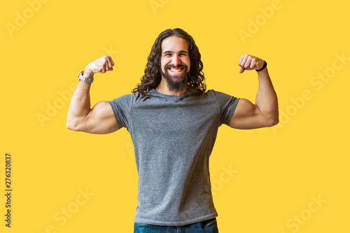 Portrait Of Happy Strong Bearded Young Bodybuilder Man With