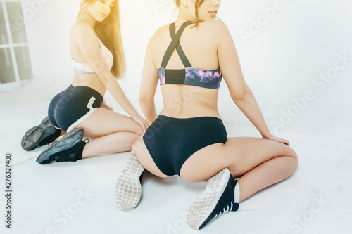 Two Beautiful Womans Dancing Booty Twerk Sitting On The Floor On A