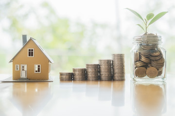 Saving money to invest in house or property in the future. Business Finance Concept.