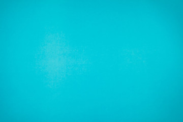 A little mottled bright blue turquoise paper plain and solid for minimal object background.