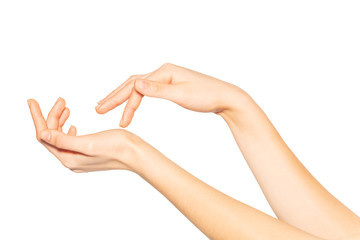 beautiful female hands applying hand cream on white