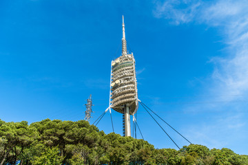 Barcelona, Spain - April 2019: TV tower Torre de Collserola on the Tibidabo hill in Barcelona, Spain