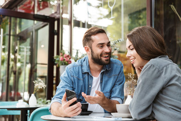Wall Mural - attractive young couple in love having lunch