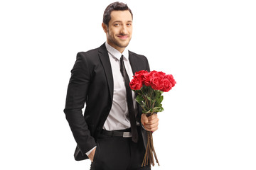 Sticker - Young man in a suit holding a bunch of red roses