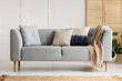 © Photographee.eu - Various cushions on the sofa in stylish living room