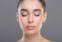 Portrait Of Beautiful Woman With Clean Skin And Closed Eyes