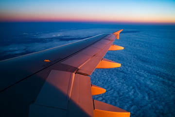 Wall Mural - Aerial view from airplane window at sunset