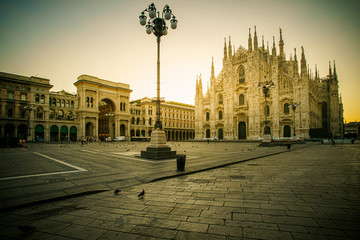 Wall Mural - Milan Piazza del Duomo square. City center illuminated in the sunrise. Milano, Italy