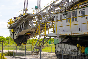 Opencast brown coal mine. Excavator SchRs-315. Extractive industry.