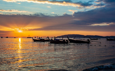 Wall Mural - Longtail boats on seashore at sunset, Thailand