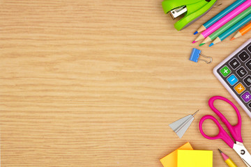 Wall Mural - School supplies side border. Overhead view on a wood background with copy space. Back to school concept.