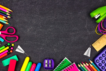 Wall Mural - School supplies border frame. Top view on a chalkboard background with copy space. Back to school concept.