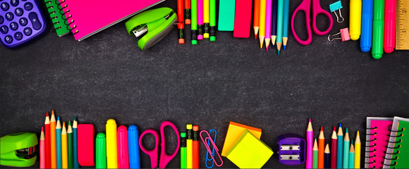 Wall Mural - School supplies double border banner. Overhead view on a chalkboard background with copy space. Back to school concept.
