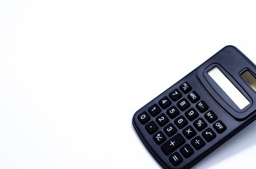 Black calculator placed isolated on a white background.Copy space.