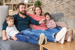 © Africa Studio - Happy family watching TV at home