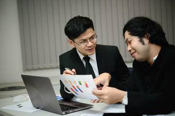 Two Asian businessmen success concept,Thailand employee happy from work finished