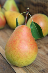 ripe pears on wooden table