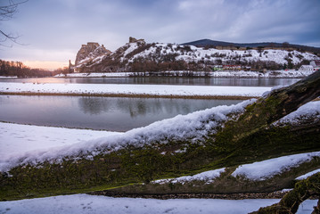 Wall Mural - Snow Covered Devin Castle Ruins above the Danube River in Bratislava, Slovakia at Sunrise