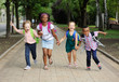 © Evgeniy Kalinovskiy - small schoolchildren with colorful school bags and backpacks run to school. Back to school, education, elementary school.