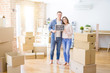 © Krakenimages.com - Beautiful young couple hugging in love and holding blackboard moving to a new home, smiling happy for new apartment