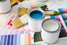 Cans Of Paint With Brushes And Palette Samples