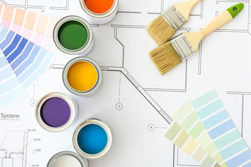 Canvas Print - Cans of paint with brushes, palette samples and house plan