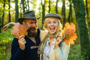 Autumn couple on fall nature background. People in love on Autumn background. Hello Autumn.