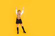 © deagreez - Rear back behind full length body size view of her she nice-looking attractive straight-haired pre-teen girl standing raising hands up having fun isolated on bright vivid shine yellow background