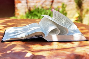 Wall Mural - An open Bible on the table. The book of life